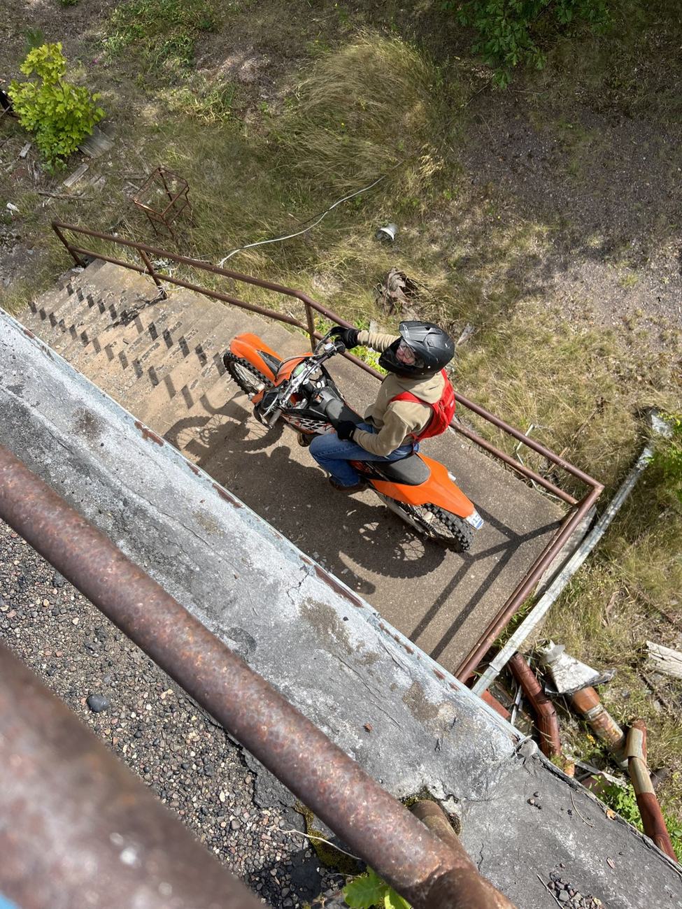 Riding a dirtbike down an old stairway